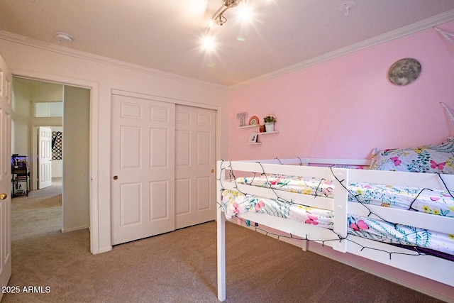 bedroom with light carpet, ornamental molding, and a closet