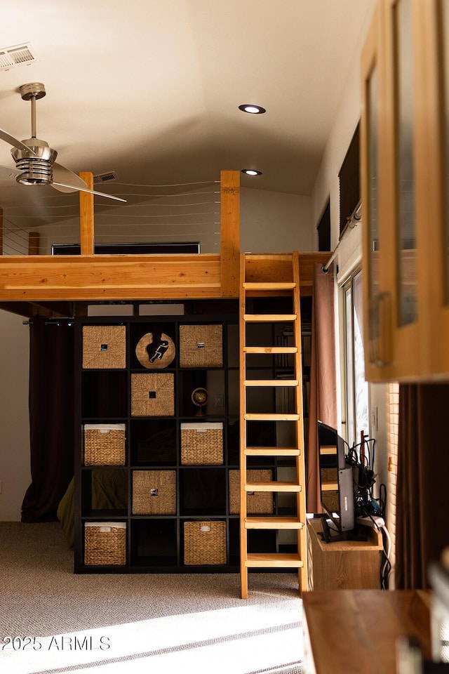 interior space featuring ceiling fan