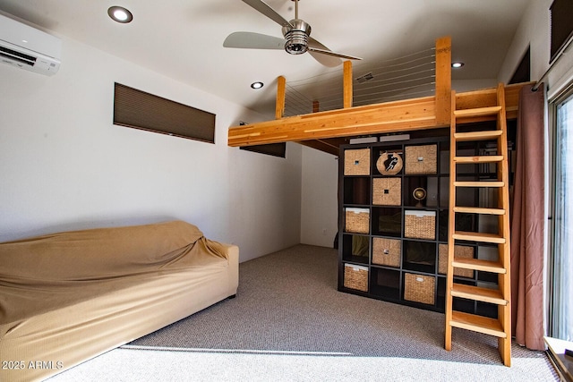 sitting room with a wall unit AC, ceiling fan, and carpet