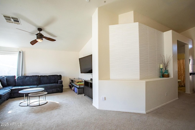 carpeted living room with ceiling fan