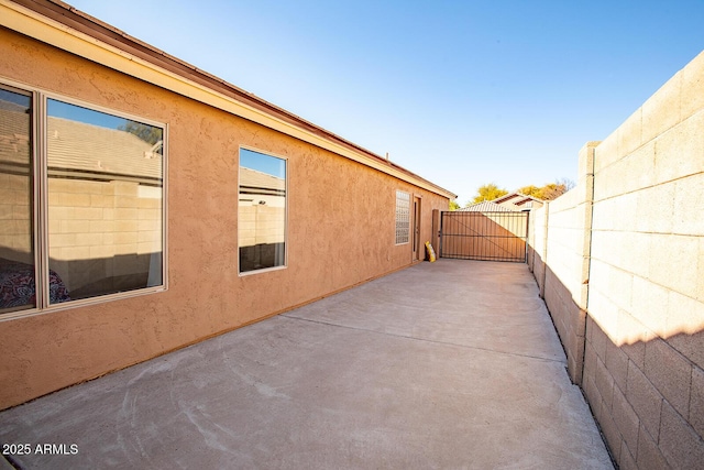 view of side of home featuring a patio area