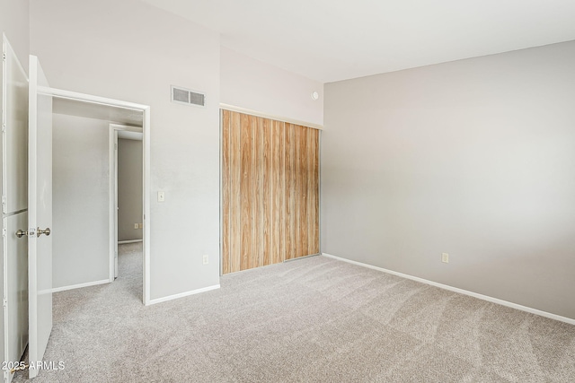 2515 S Maple Ave Unit 103, Tempe, AZ 85282 - unfurnished bedroom with carpet floors, a closet, and baseboards