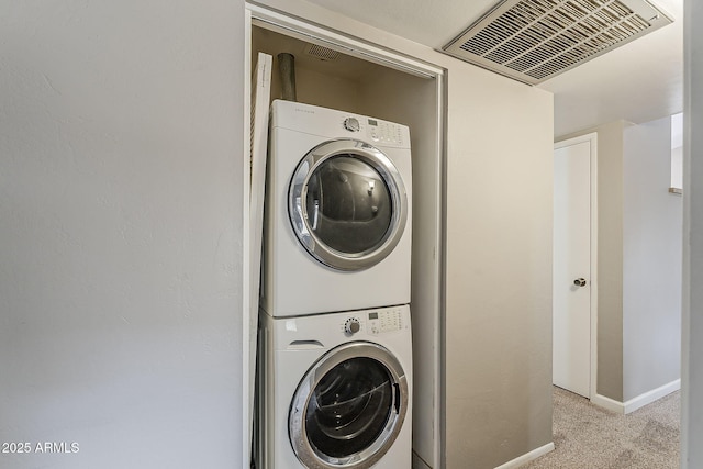 2515 S Maple Ave Unit 103, Tempe, AZ 85282 - washroom with stacked washer / drying machine, carpet floors, and baseboards