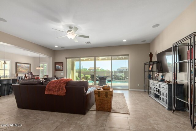 5771 W Cinder Brook Way, Florence, AZ 85132 - living room with ceiling fan, light tile patterned floors, and recessed lighting