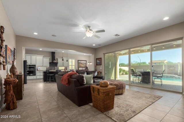 5771 W Cinder Brook Way, Florence, AZ 85132 - living area featuring light tile patterned floors, ceiling fan, and recessed lighting