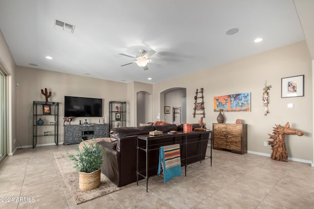 5771 W Cinder Brook Way, Florence, AZ 85132 - living room featuring arched walkways, a ceiling fan, light tile patterned flooring, recessed lighting, and baseboards