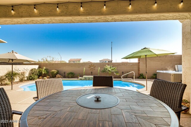5771 W Cinder Brook Way, Florence, AZ 85132 - view of pool with outdoor dining area, a fenced backyard, and a patio