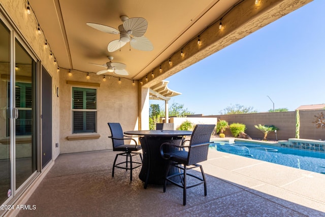 5771 W Cinder Brook Way, Florence, AZ 85132 - view of patio with a fenced backyard, a ceiling fan, and outdoor dining space