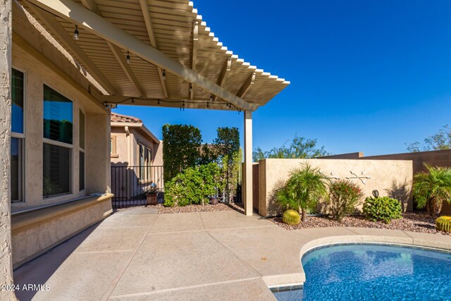 5771 W Cinder Brook Way, Florence, AZ 85132 - view of patio with fence and a pergola