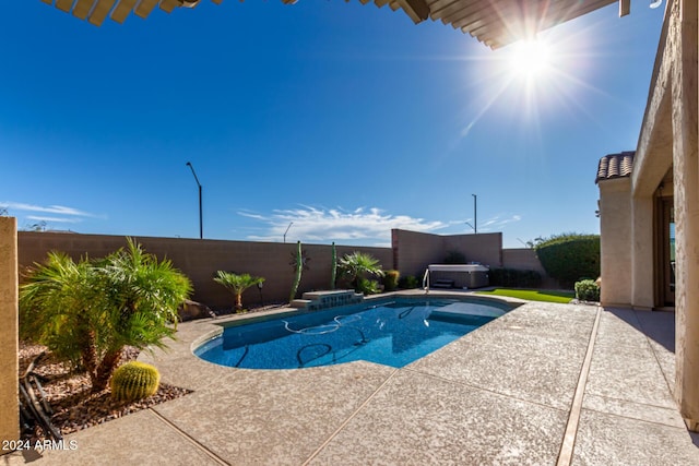 5771 W Cinder Brook Way, Florence, AZ 85132 - view of swimming pool with a hot tub, a patio area, and a fenced backyard