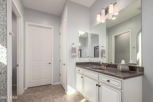 5771 W Cinder Brook Way, Florence, AZ 85132 - full bath featuring vanity, tile patterned floors, and toilet