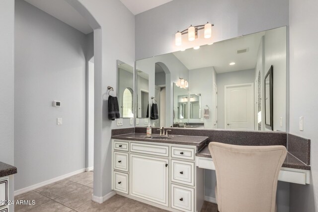 5771 W Cinder Brook Way, Florence, AZ 85132 - bathroom featuring tile patterned floors, vanity, and baseboards