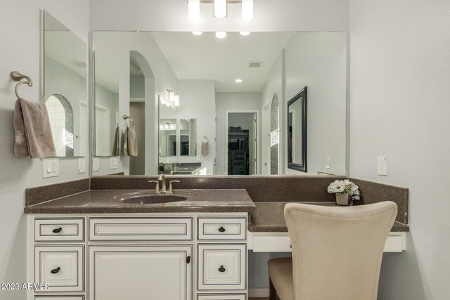 5771 W Cinder Brook Way, Florence, AZ 85132 - bathroom with vanity and a closet