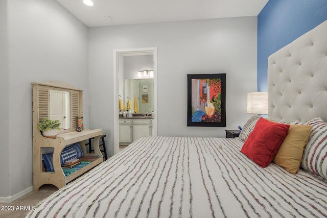 5771 W Cinder Brook Way, Florence, AZ 85132 - carpeted bedroom featuring ensuite bathroom and baseboards