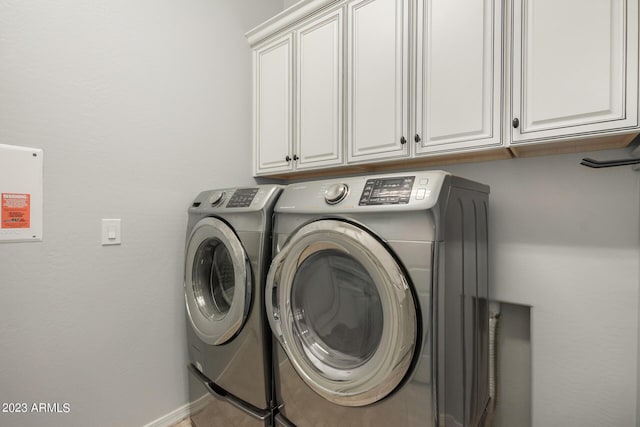 5771 W Cinder Brook Way, Florence, AZ 85132 - washroom with cabinet space, separate washer and dryer, and baseboards