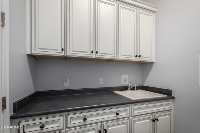 5771 W Cinder Brook Way, Florence, AZ 85132 - clothes washing area with a sink