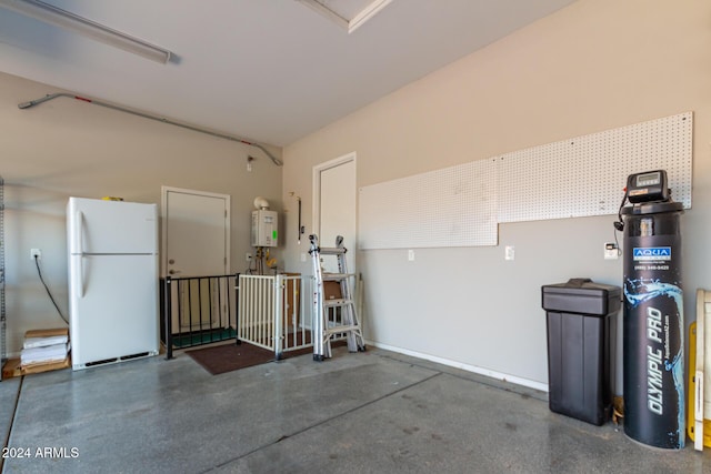 5771 W Cinder Brook Way, Florence, AZ 85132 - garage with freestanding refrigerator and tankless water heater