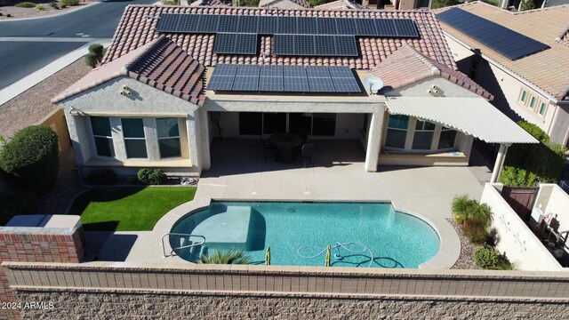5771 W Cinder Brook Way, Florence, AZ 85132 - rear view of house with a patio, solar panels, and a tiled roof