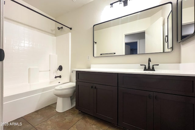bathroom featuring toilet, vanity,  shower combination, and tile patterned floors