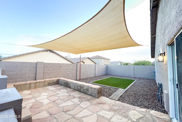 view of patio with a fenced backyard