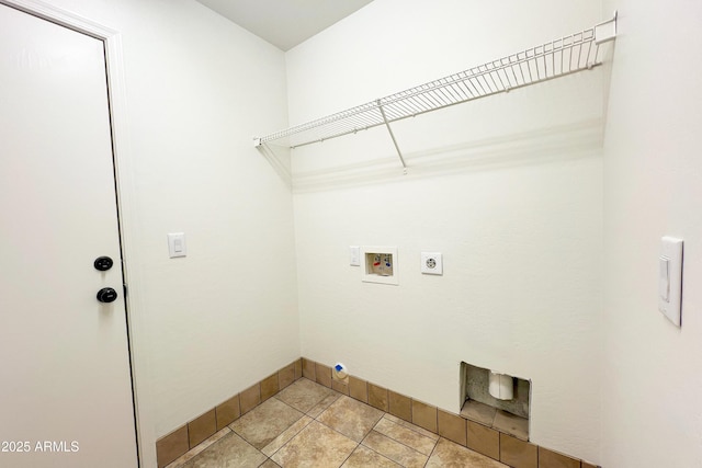 washroom with hookup for a washing machine, baseboards, electric dryer hookup, and light tile patterned flooring