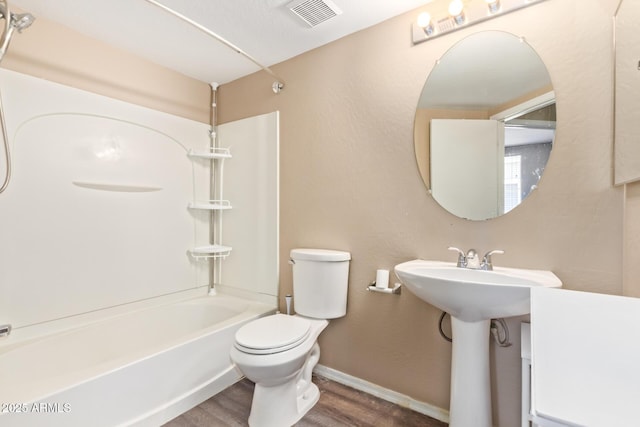 9233 E Neville Ave Unit 1127, Mesa, AZ 85209 - bathroom with washtub / shower combination and wood finished floors