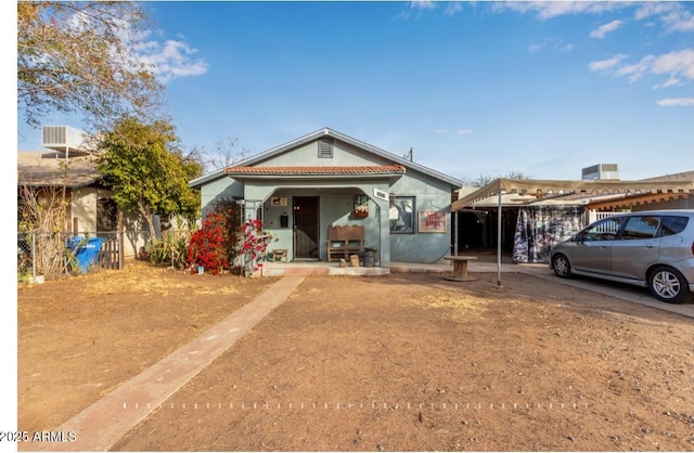 bungalow-style home featuring a carport