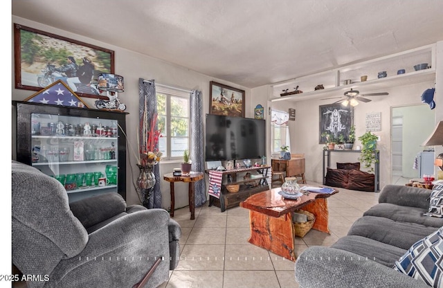 tiled living room featuring ceiling fan