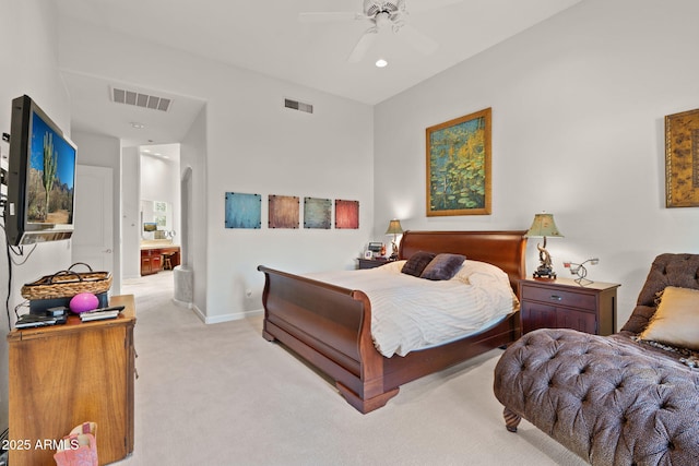 carpeted bedroom featuring connected bathroom and ceiling fan