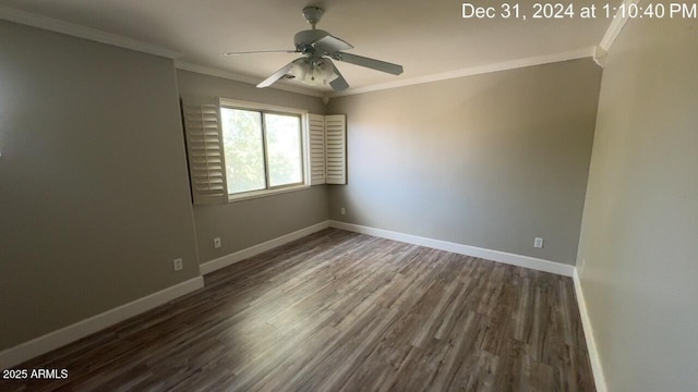 spare room featuring ornamental molding, wood finished floors, a ceiling fan, and baseboards