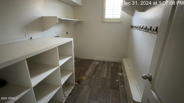 washroom featuring laundry area, hookup for an electric dryer, and wood finished floors