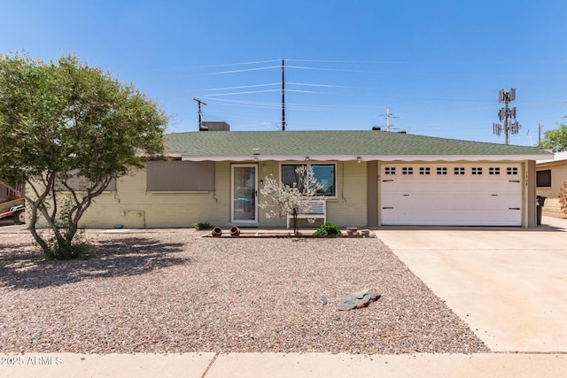 1308 N 66th St, Scottsdale, AZ 85257 - ranch-style house featuring an attached garage, driveway, and roof with shingles