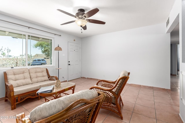 1308 N 66th St, Scottsdale, AZ 85257 - living area with ceiling fan and light tile patterned flooring