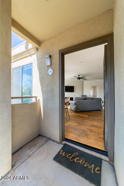 entrance to property with ceiling fan