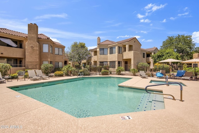 view of swimming pool featuring a patio area