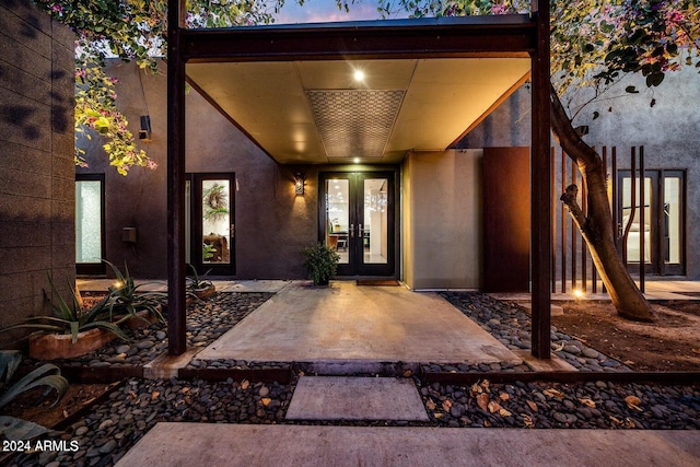 exterior entry at dusk with french doors