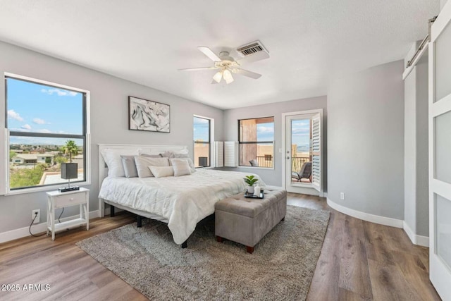13227 N Mimosa Dr Unit 101, Fountain Hills, AZ 85268 - bedroom featuring access to outside, wood finished floors, and a ceiling fan