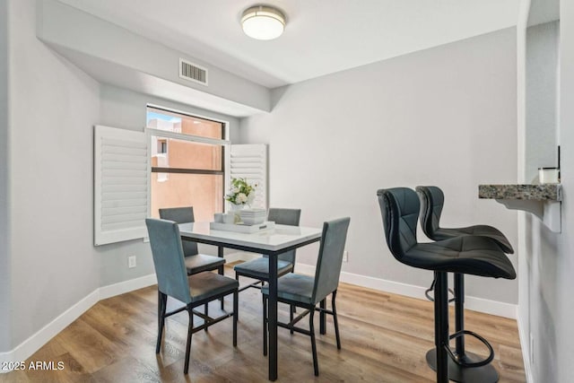 13227 N Mimosa Dr Unit 101, Fountain Hills, AZ 85268 - dining area with baseboards and wood finished floors
