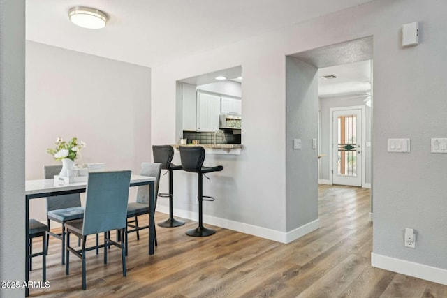 13227 N Mimosa Dr Unit 101, Fountain Hills, AZ 85268 - dining space with wood finished floors and baseboards