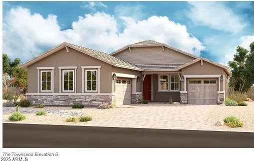 craftsman inspired home with decorative driveway, stone siding, an attached garage, and stucco siding