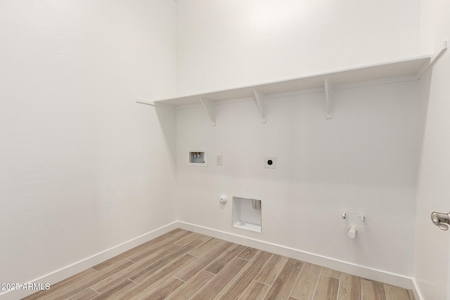 laundry room with light wood finished floors, laundry area, and hookup for a gas dryer