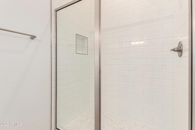 bathroom featuring a shower stall