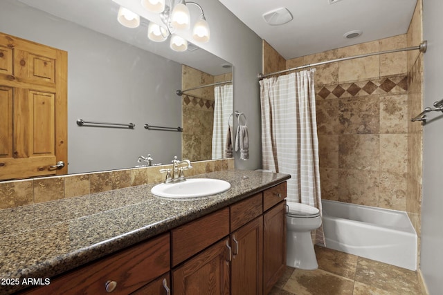 full bathroom with a notable chandelier, shower / bath combo with shower curtain, toilet, and vanity