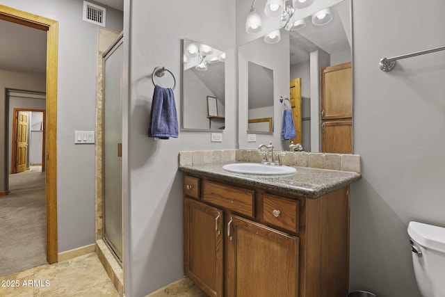 full bathroom featuring visible vents, baseboards, toilet, a stall shower, and vanity