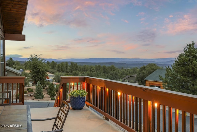 balcony at dusk with a mountain view