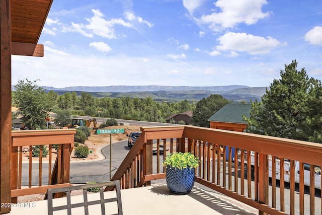 wooden terrace featuring a mountain view