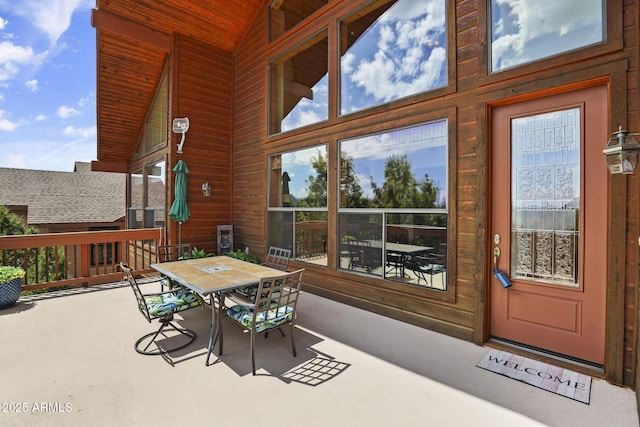 sunroom / solarium with lofted ceiling