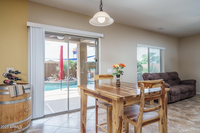 dining room featuring light tile patterned floors