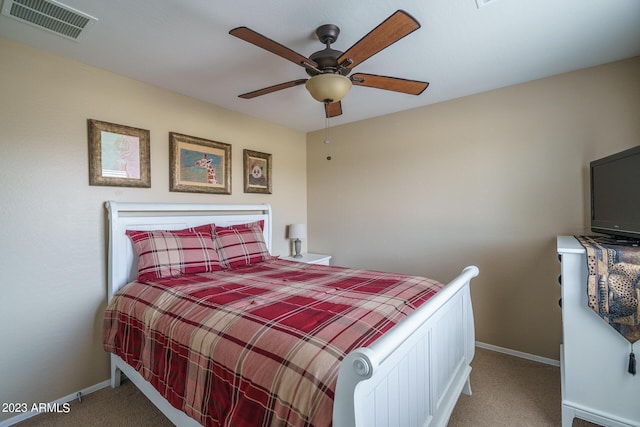 bedroom with ceiling fan and carpet floors