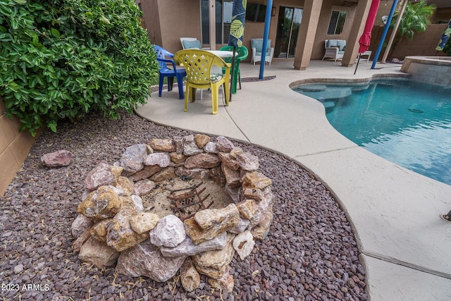 view of swimming pool featuring a patio area